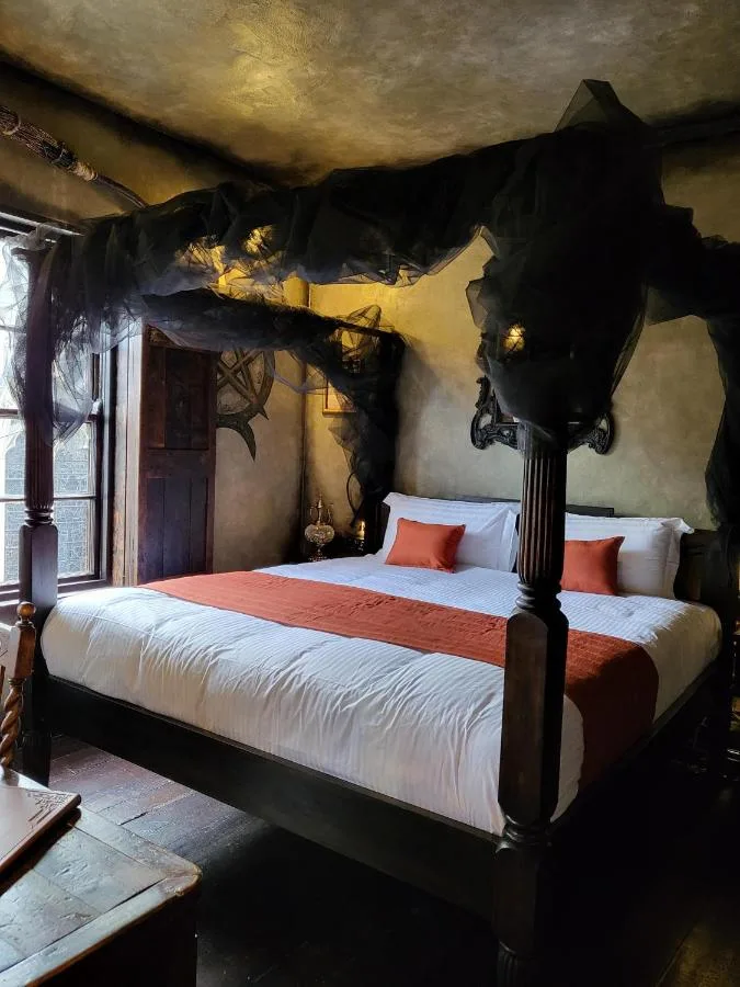 A bedroom with a large bed at Hocus Pocus Tiny Hotel on Patrick Pool, York