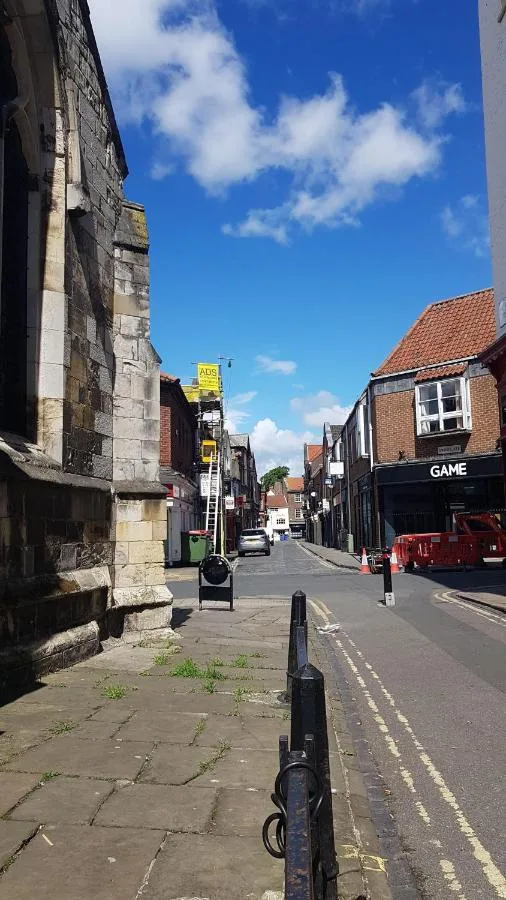 A view along a historic street near Hocus Pocus Tiny Hotel, York